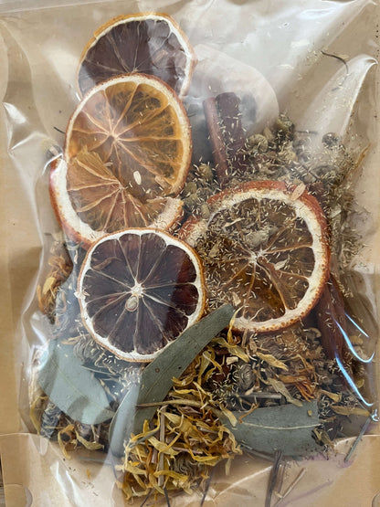 Seasonal Dry or Simmering Potpourris featuring dried citrus and herbs in a clear bag, perfect for home fragrance.