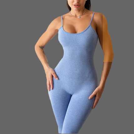 Woman wearing a blue bodysuit against a plain background