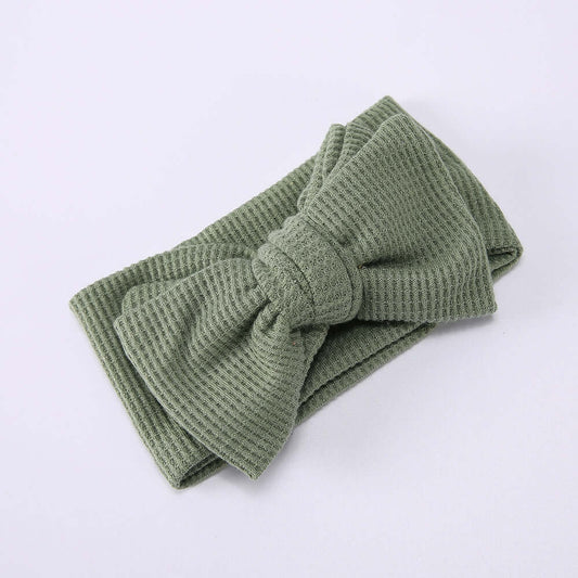 Children's Waffle Knit Oversized Bow Headband in soft green fabric for kids' fashion.