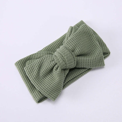 Children's Waffle Knit Oversized Bow Headband in soft green color, perfect for little girls.