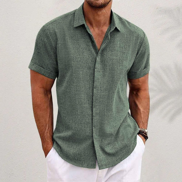 Men's linen short-sleeve t-shirt in green, relaxed fit with short sleeves and standing collar, perfect for warm weather.