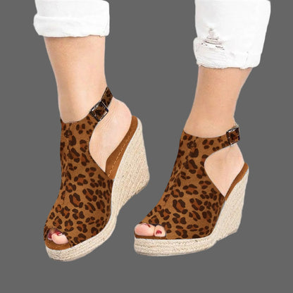 Leopard print wedge sandals on a white background