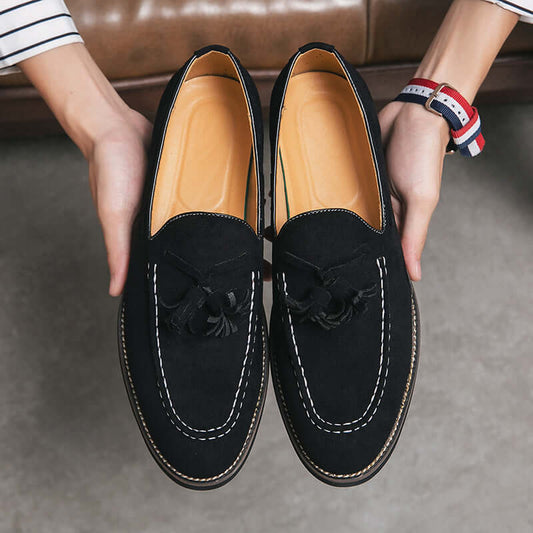 Men's black suede slip-on shoes with tassels, ideal for business casual style and comfort.