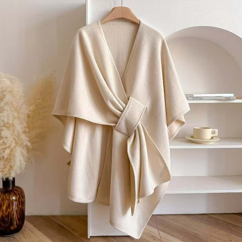 Women's Cotton Twill Cardigan Cape And Shawl displayed on a hanger in a stylish interior setting.