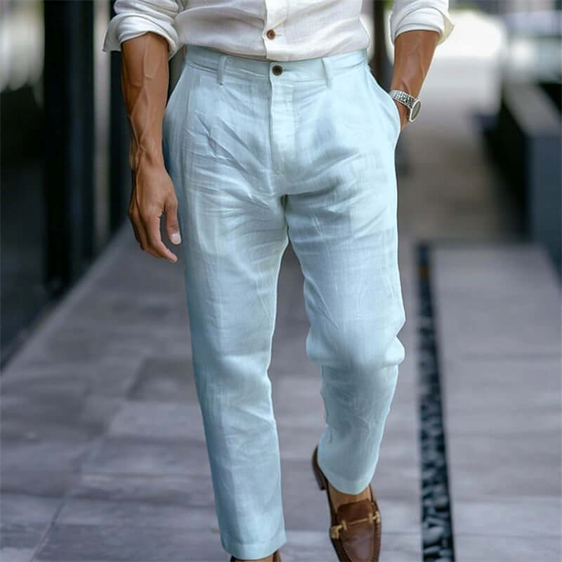 Light blue pants worn by a person on a blurred street background
