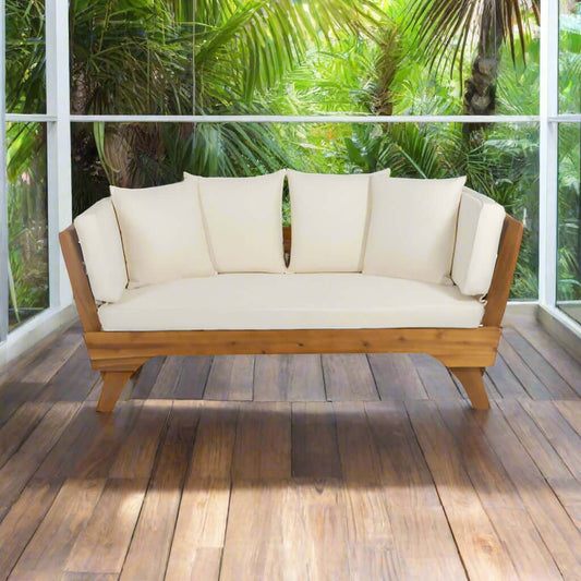 Wooden sofa with white cushions on a white background