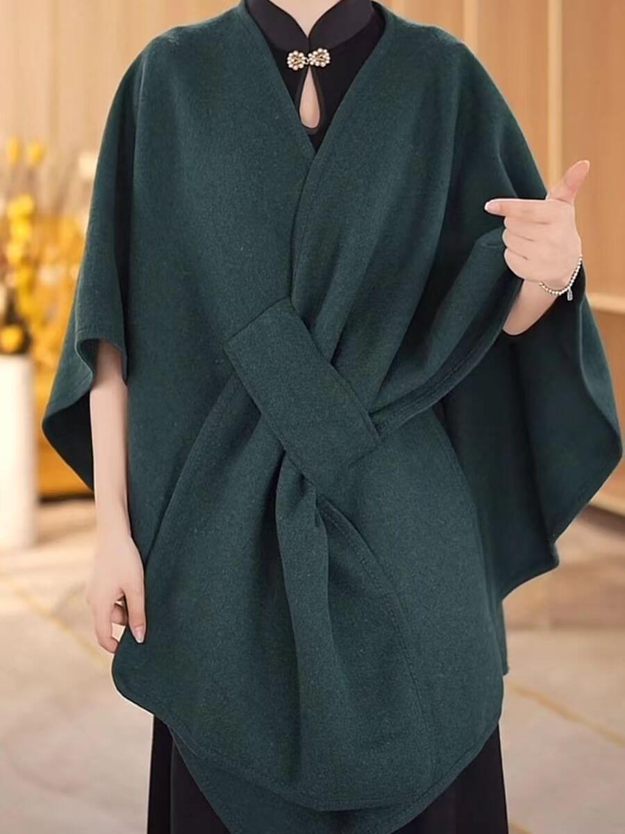 Women wearing a stylish Women's Cotton Twill Cardigan Cape And Shawl in green, perfect for any season.