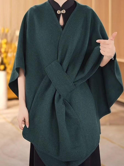 Women wearing a stylish Women's Cotton Twill Cardigan Cape And Shawl in green, perfect for any season.