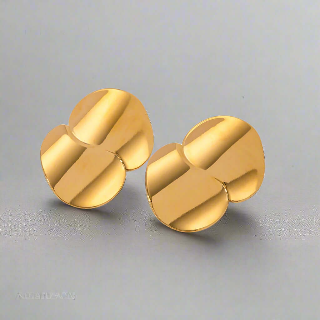 Stainless Steel Minimalist Geometric Curve Earrings featuring a warm gold glow with a contemporary design.