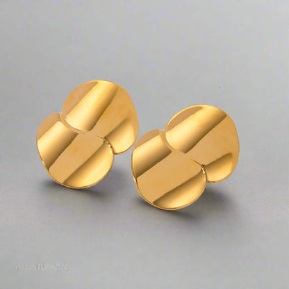 Stainless Steel Minimalist Geometric Curve Earrings featuring a warm gold glow with a contemporary design.