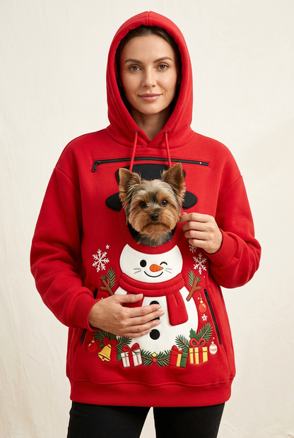 Model wearing the red snowman hoodie with a Yorkie peeking through the opening