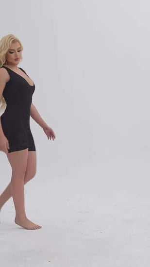 Woman wearing a black Women Tummy Control Full Body Shaper, showcasing a smooth silhouette and comfort.