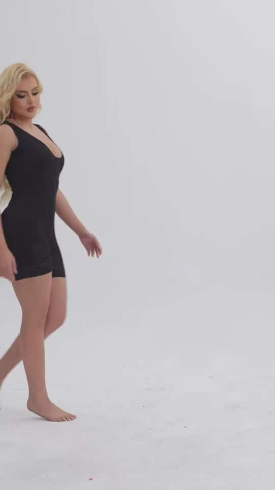 Woman wearing a black Women Tummy Control Full Body Shaper, showcasing a smooth silhouette and comfort.